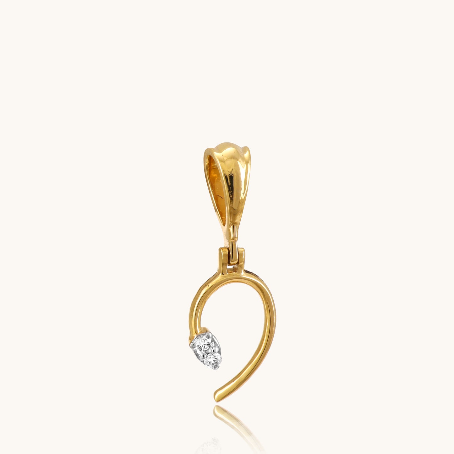 Unlock the allure of our captivating 18kt gold Hooked Diamond Locket, perfect for everyday wear. Add a touch of mystery to your casual, work, or evening attire with this secret keeper. Ideal for her or as a treasure for yourself, all under 10,000