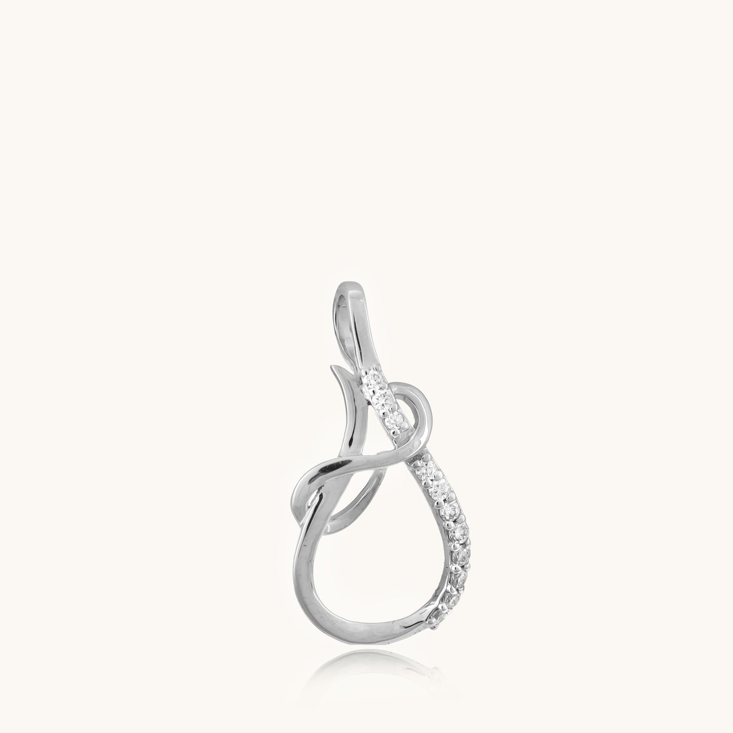 Upgrade your look with our 18kt Looped Diamond Pendant from the Spring Edit, priced under Rs. 30,000. This versatile jewelry piece seamlessly transitions from day to night, adding a touch of elegance to any outfit. A stunning addition to her collection and a thoughtful gift idea.