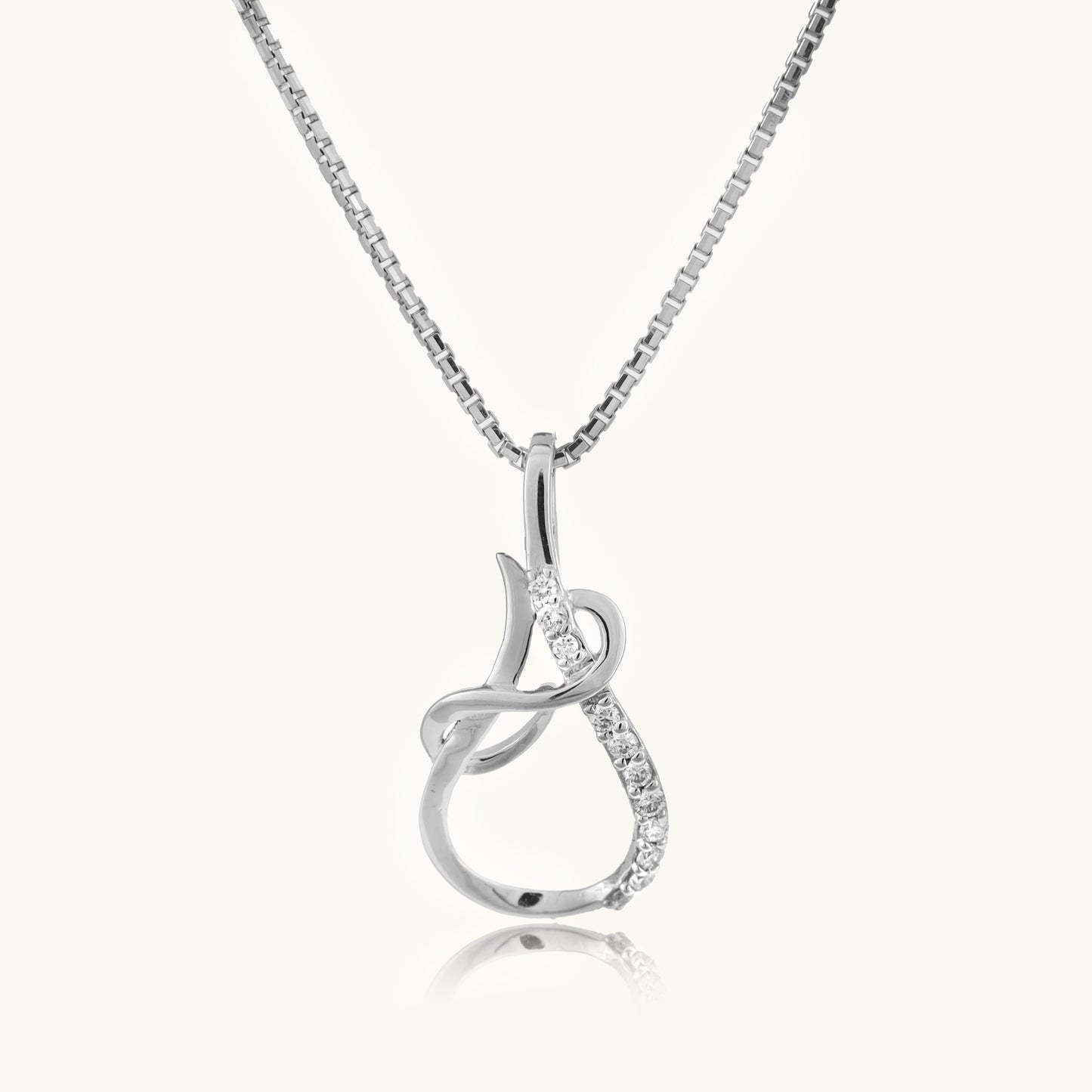 Upgrade your look with our 18kt Looped Diamond Pendant from the Spring Edit, priced under Rs. 30,000. This versatile jewelry piece seamlessly transitions from day to night, adding a touch of elegance to any outfit. A stunning addition to her collection and a thoughtful gift idea.