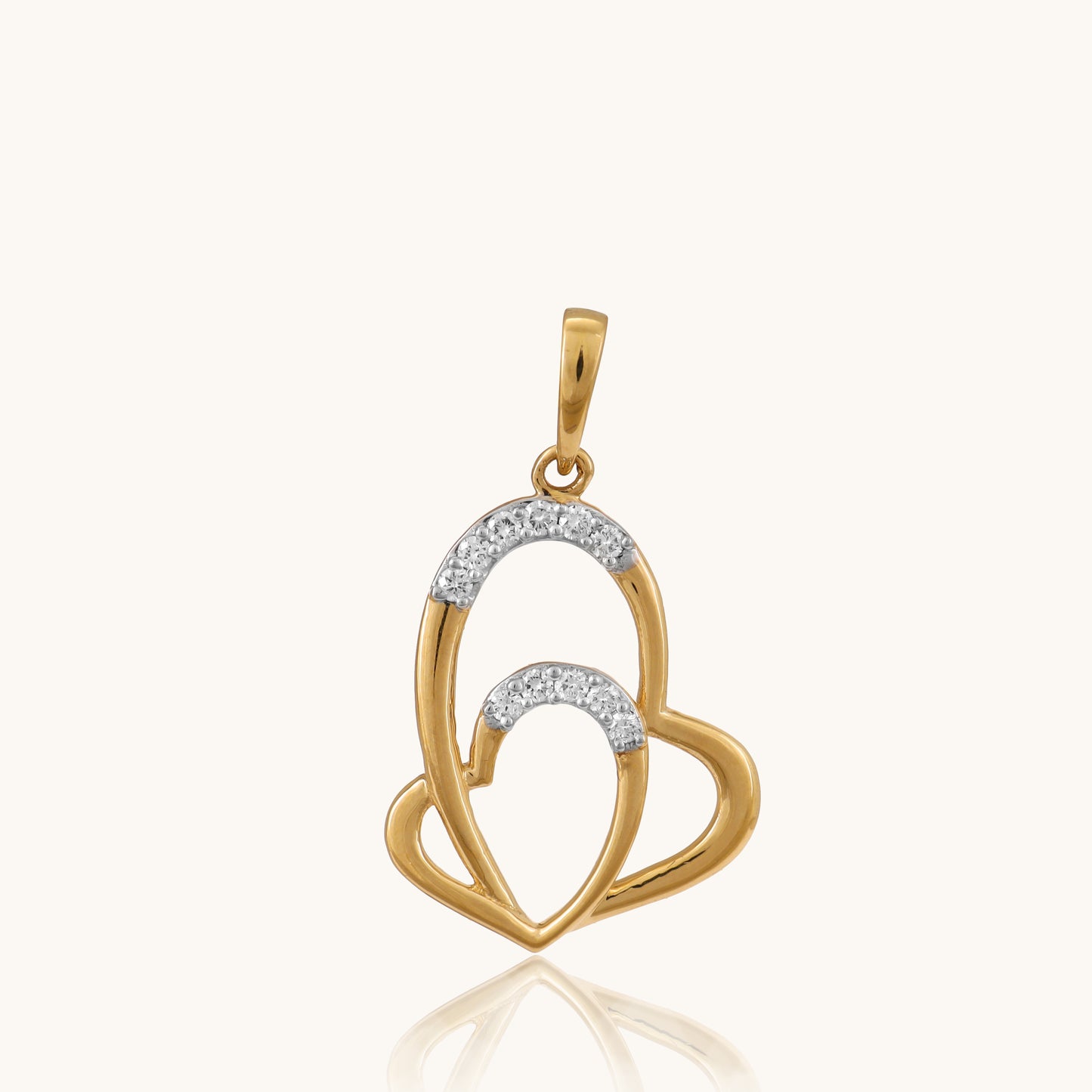 Celebrate love in style with our captivating 18kt gold Interloop Heart Pendant. Featuring two interlocking hearts, this romantic design symbolizes timeless connection and affection. Perfect for everyday wear, it adds elegance to casual looks, workwear, or evening attire. The ideal gift for her under 30,000.