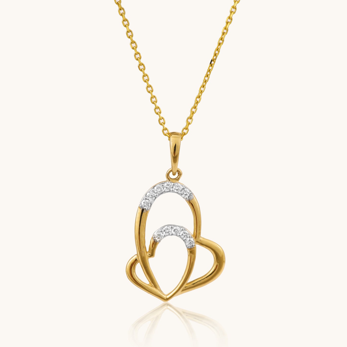Celebrate love in style with our captivating 18kt gold Interloop Heart Pendant. Featuring two interlocking hearts, this romantic design symbolizes timeless connection and affection. Perfect for everyday wear, it adds elegance to casual looks, workwear, or evening attire. The ideal gift for her under 30,000.