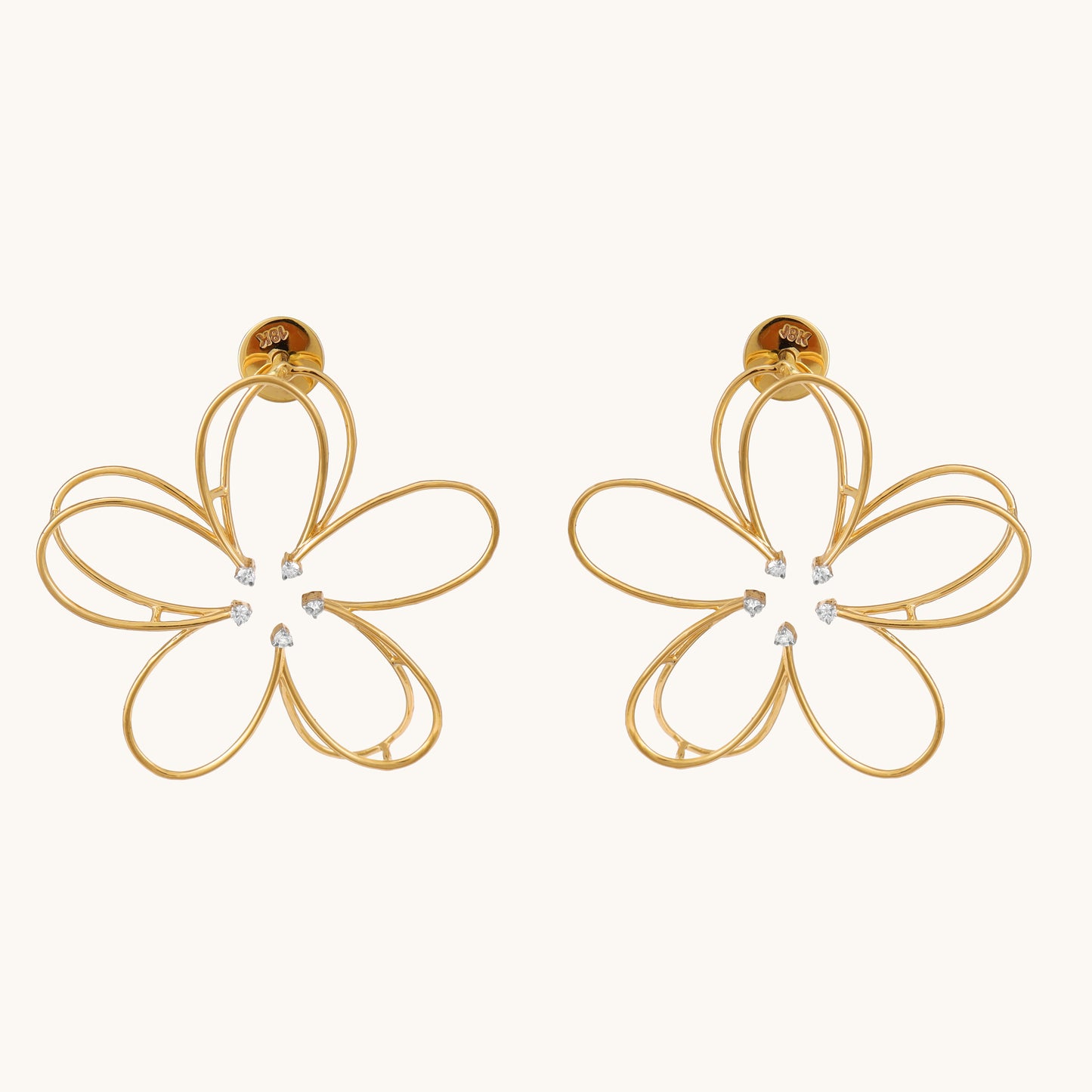 Embrace springtime elegance with the Flower Diamond Earrings, crafted in 18kt gold and featuring sparkling diamonds. These earrings add a touch of floral charm to your everyday look, perfect for casual wear, work attire, or a special occasion. They make a delightful gift for her Under Rs. 50,000.