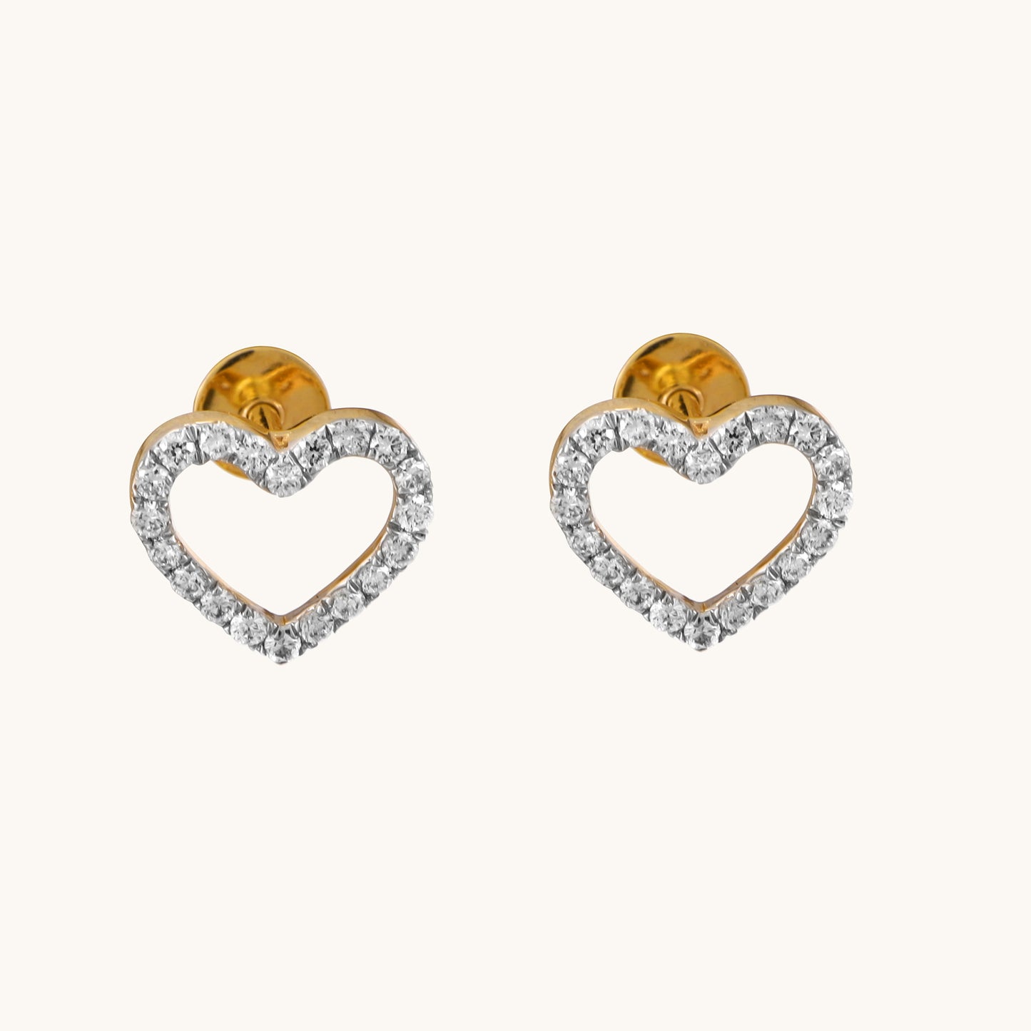 Enhance your style with our 18 kt Heart Basic Earring from the Spring Edit, priced under Rs. 30,000. Versatile from day to night, this exquisite jewelry piece makes a stunning addition to her collection and a thoughtful gifting idea. Shop now and add sophistication to any ensemble.