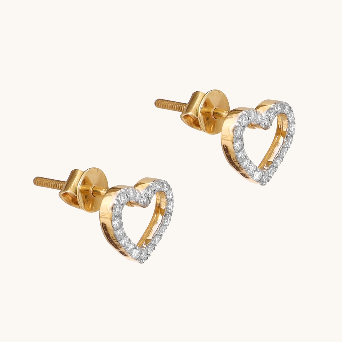 Enhance your style with our 18 kt Heart Basic Earring from the Spring Edit, priced under Rs. 30,000. Versatile from day to night, this exquisite jewelry piece makes a stunning addition to her collection and a thoughtful gifting idea. Shop now and add sophistication to any ensemble.