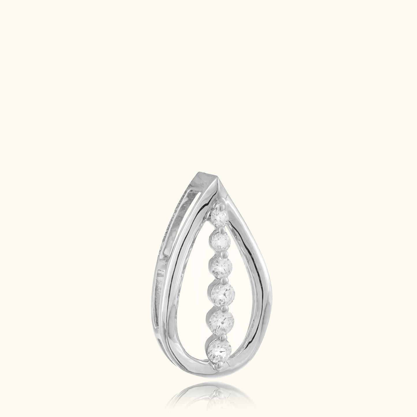Indulge in timeless elegance with our 18 kt Teardrop Diamond Pendant from the Spring Edit collection, priced below 30,000. This exquisite piece is a must-have addition to your everyday jewelry collection, radiating sophistication and grace. Whether for personal adornment or as a heartfelt gift.