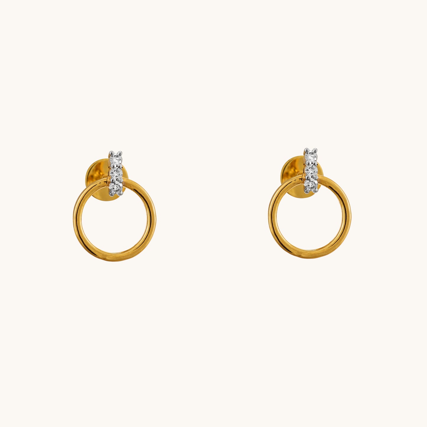 Elevate your style with the Circlet Diamond Earrings, crafted in 18kt gold and adorned with delicate diamonds. Perfect for everyday wear or adding a touch of sophistication to work or casual attire, these hoop earrings exude timeless elegance. A thoughtful and affordable gift idea for her under Rs. 30,000, these earrings are sure to impress.