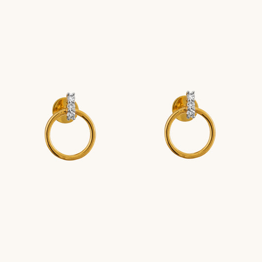 Elevate your style with the Circlet Diamond Earrings, crafted in 18kt gold and adorned with delicate diamonds. Perfect for everyday wear or adding a touch of sophistication to work or casual attire, these hoop earrings exude timeless elegance. A thoughtful and affordable gift idea for her under Rs. 30,000, these earrings are sure to impress.