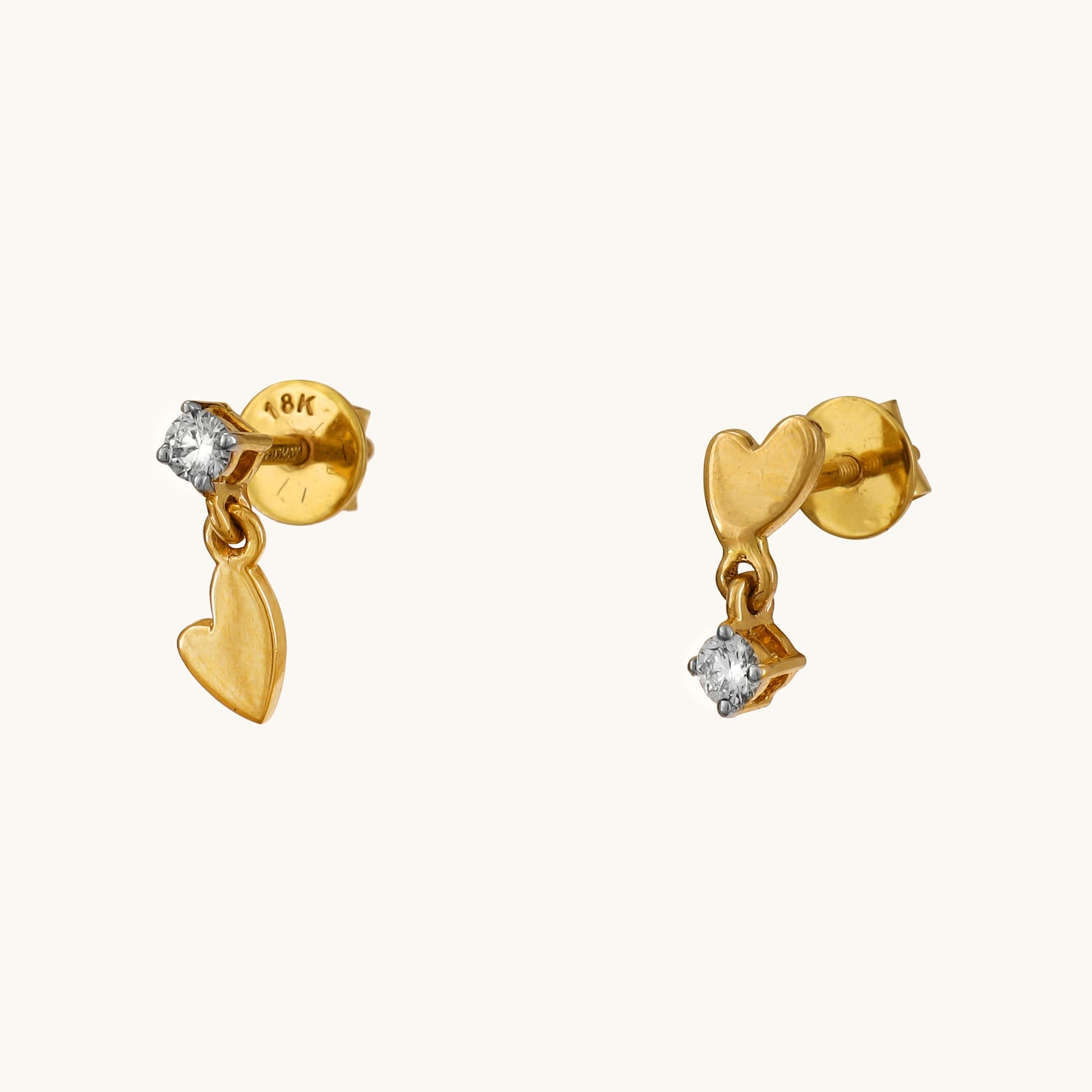 Elevate your style with our Spring Edit, featuring captivating 18 kt Dangling Heart Earrings. This stunning jewellery piece effortlessly transitions from day to night, adding a touch of elegance to any ensemble. Priced under Rs. 30,000, it's a chic addition to any outfit and an ideal gifting option for her.