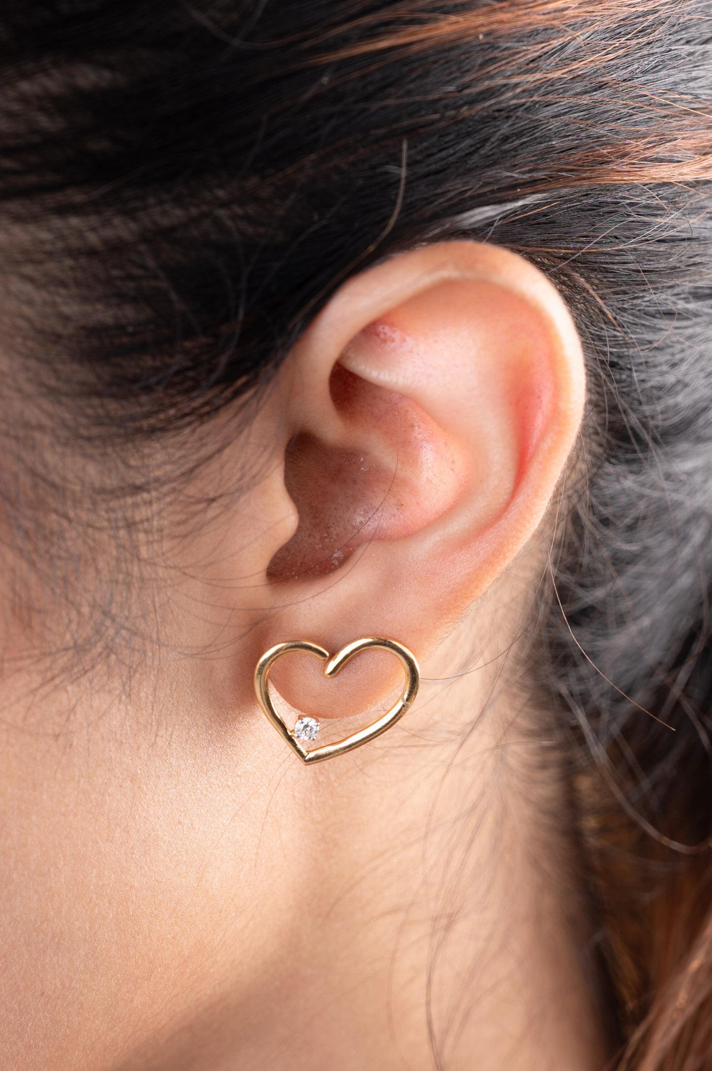 Express your love with the sparkling elegance of the Heart Diamond Earrings crafted in 18kt gold. These earrings add a touch of timeless romance to your everyday look, perfect for casual wear, work attire, or a special occasion. They make a thoughtful gift idea for her all under Rs. 30,000.