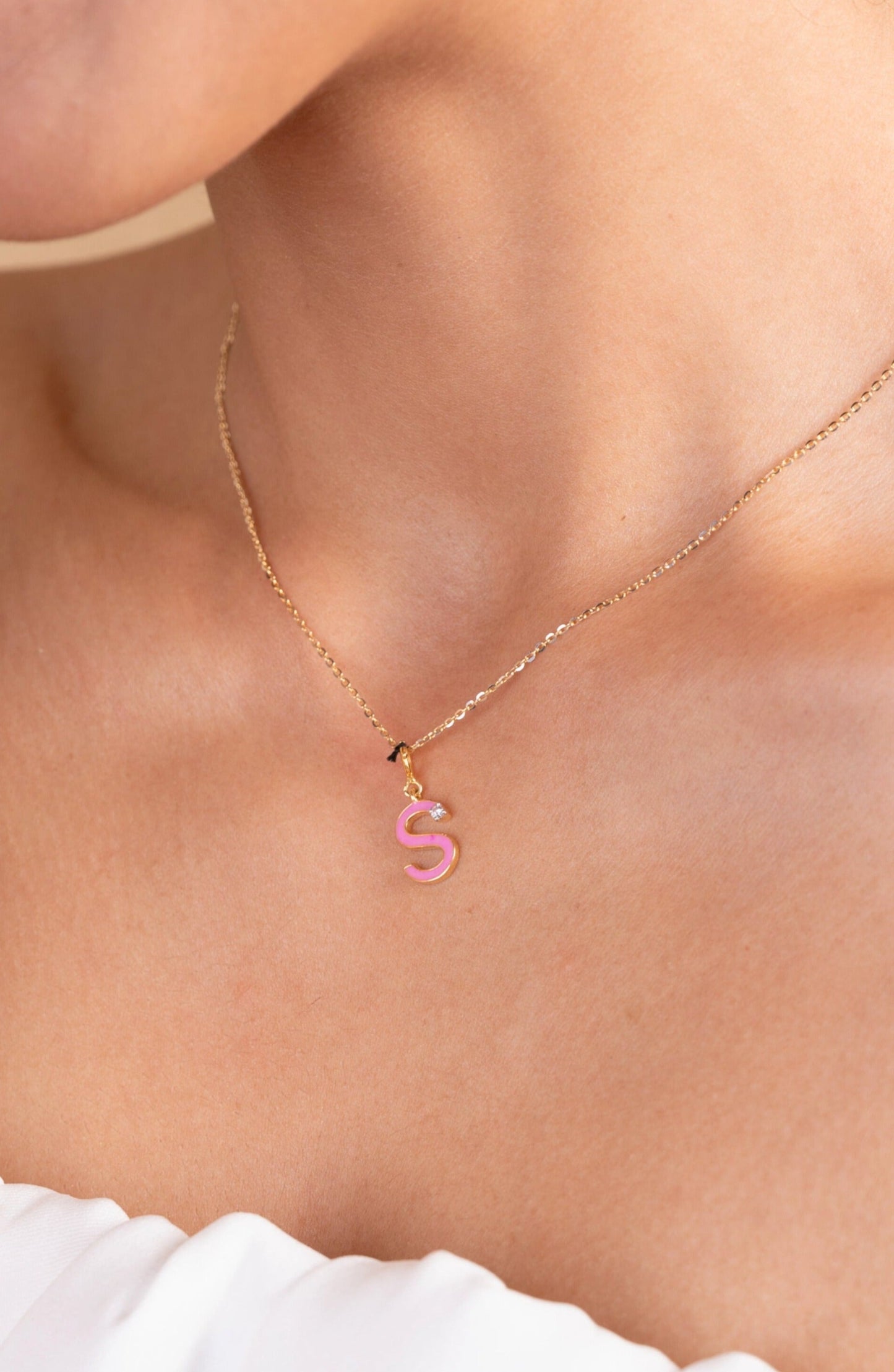 Elevate your style with our enchanting 18kt gold Pink Diamond Charm, celebrating the allure of the letter S. Whether it's adding a personal touch to your everyday ensemble, sparkling up your office attire, or enhancing your casual look, this charming piece is a versatile must-have. Perfect as a gift for her or a delightful treat for yourself, its timeless elegance is bound to captivate.