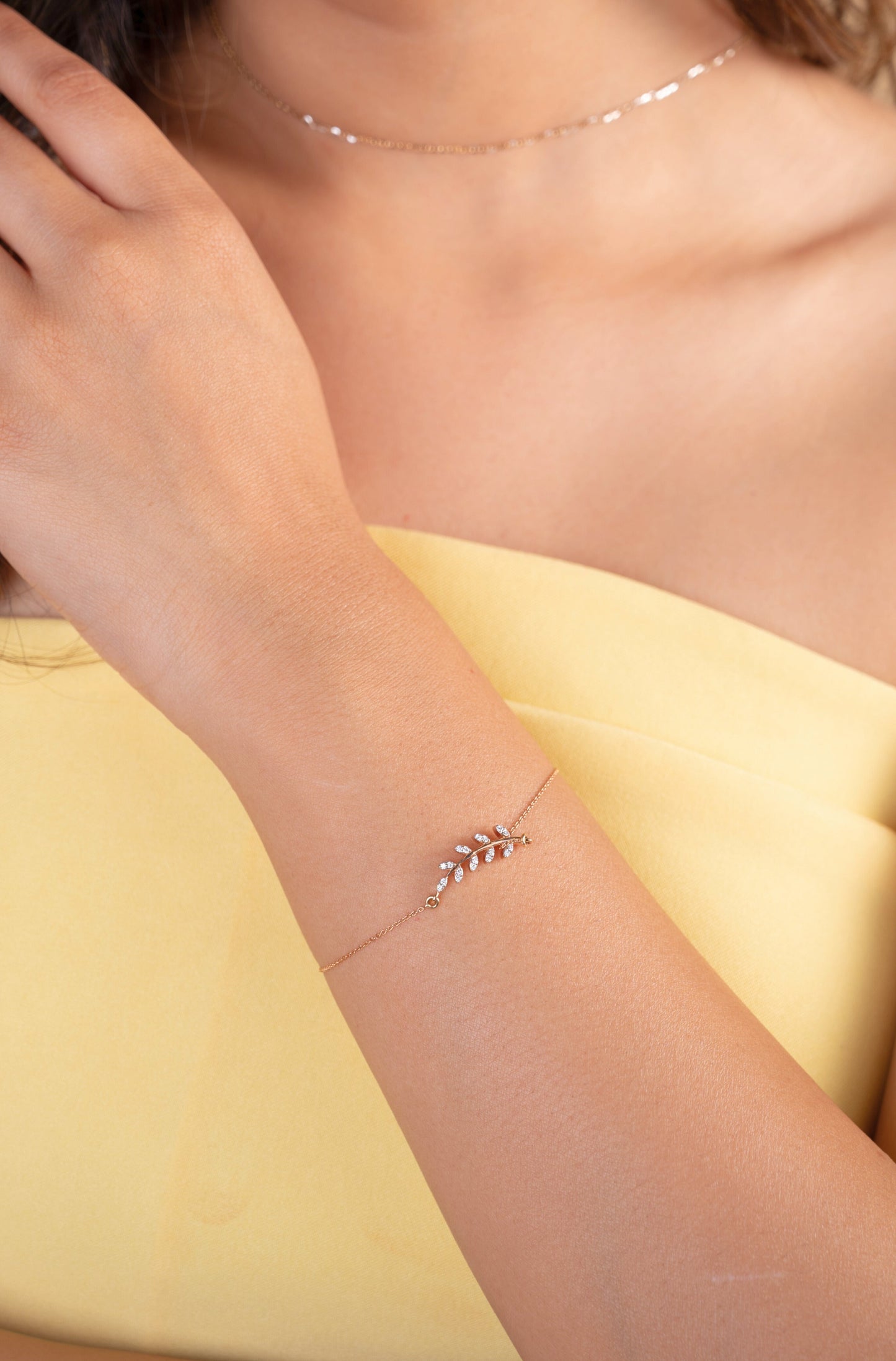 Embrace nature's elegance with the Fern Diamond Bracelet, crafted in luxurious 18kt gold. This delicate everyday accessory adds a touch of organic beauty to any casual or workwear outfit. Explore our Under 30,000 Collection for more thoughtful jewelry gifts for her or to elevate your own everyday style with effortlessly chic pieces.