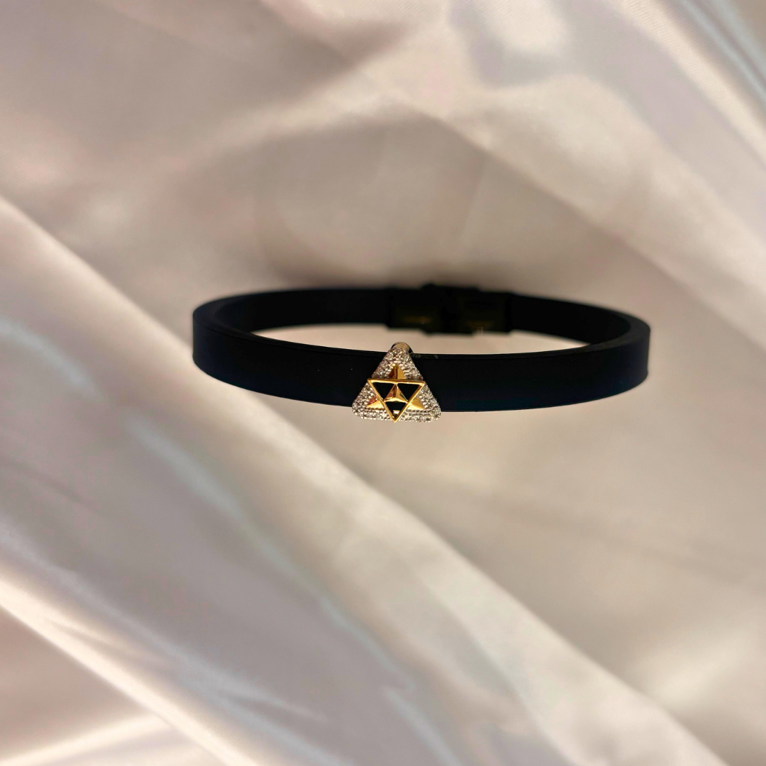 Men’s diamond bracelet by Caratly, featuring a sleek black band with a gold and diamond-studded triangular centerpiece, blending modern style with classic luxury under Rs. 30,000!