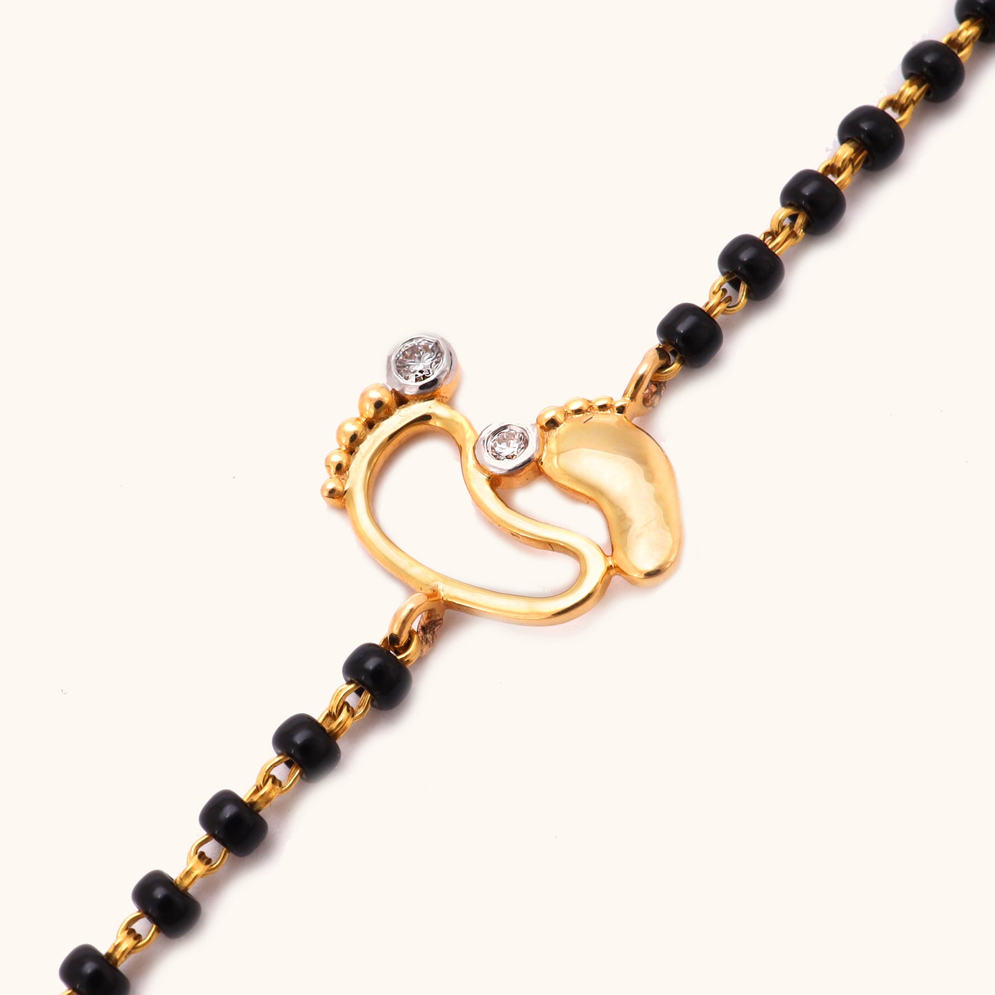 Diamond Babyfeet Nazariya in 18kt gold with IGI-certified VVS diamonds, BIS hallmarked, perfect for everyday wear and personalized jewelry gifts for babies under Rs. 25k.