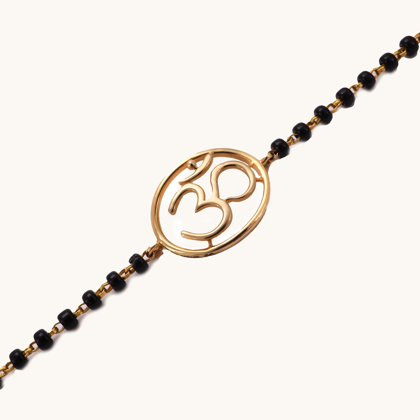 Gold Om Mangalsutra Bracelet in 18kt gold, featuring IGI certified VVS diamonds. Ideal for luxury jewelry gifts under 30k. BIS hallmarked, perfect for everyday wear and special occasions.