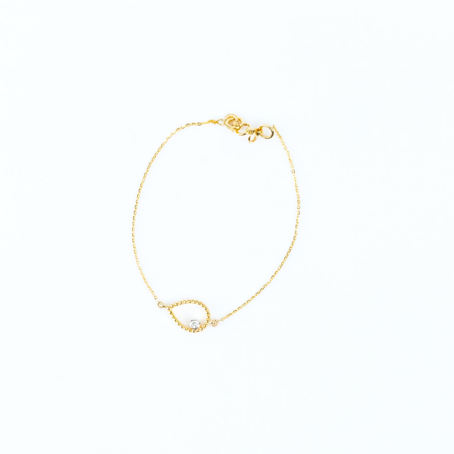 18kt Gold Pear Diamond Bracelet for women under 30,000. Delicate jewellery for everyday elegance. Gift a touch of brilliance to her to elevate her 9 to 5 look effortlessly.