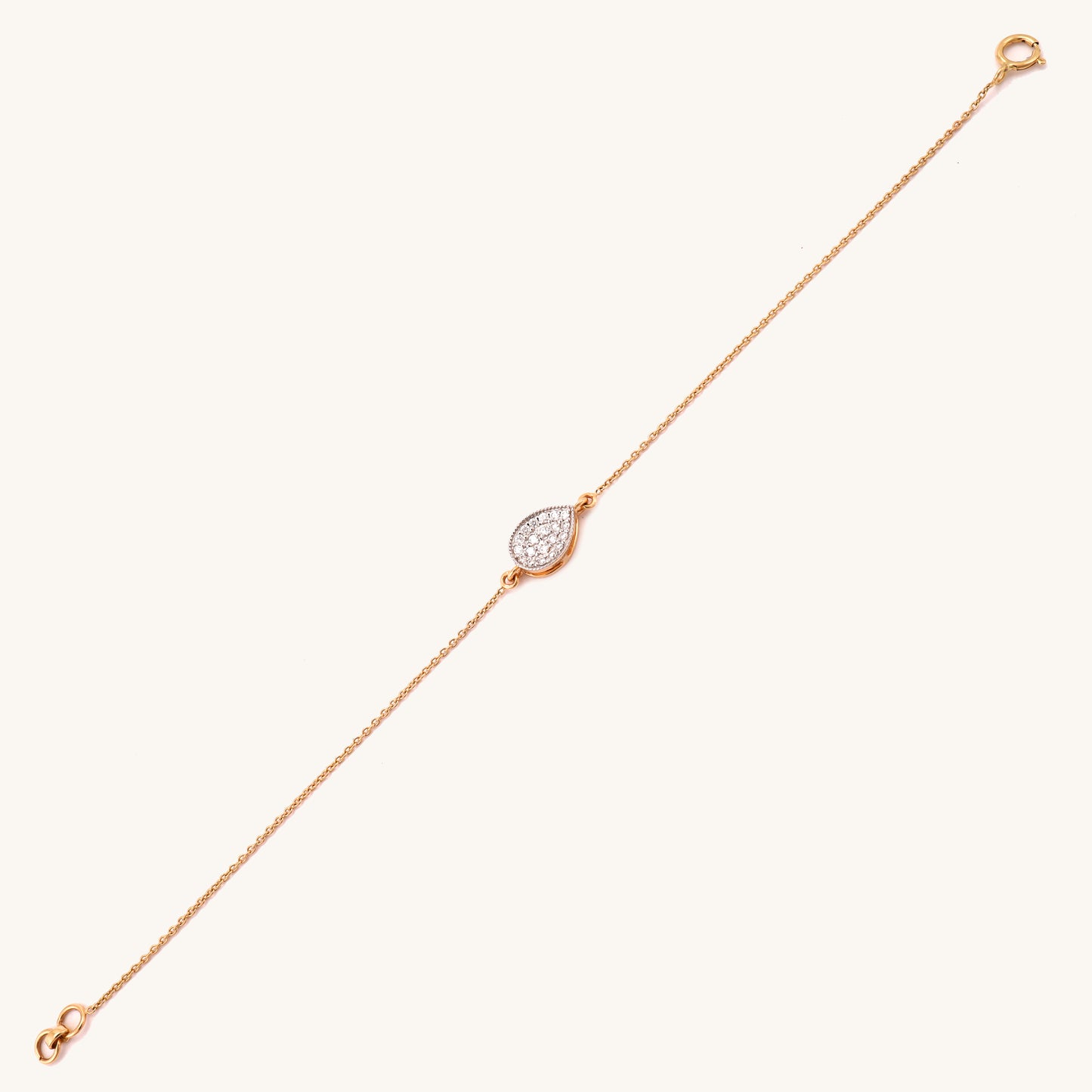 Indulge in affordable luxury with our 18kt gold Teardrop Diamond Bracelet. This exquisite piece from our Spring Edit Collection adds a touch of glamour to any outfit, elevating your everyday elegance. A must-have accessory for the fashion-conscious, all under Rs. 30,000.