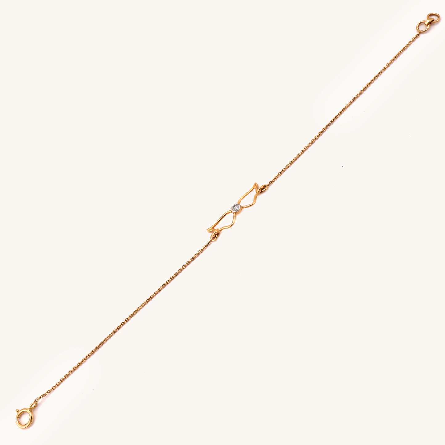 Luxurious 18kt gold Winged Diamond Bracelet elevates everyday style. Delicate and eye-catching, this bracelet transitions flawlessly from workwear to casual looks. Perfect gift under Rs. 30,000.