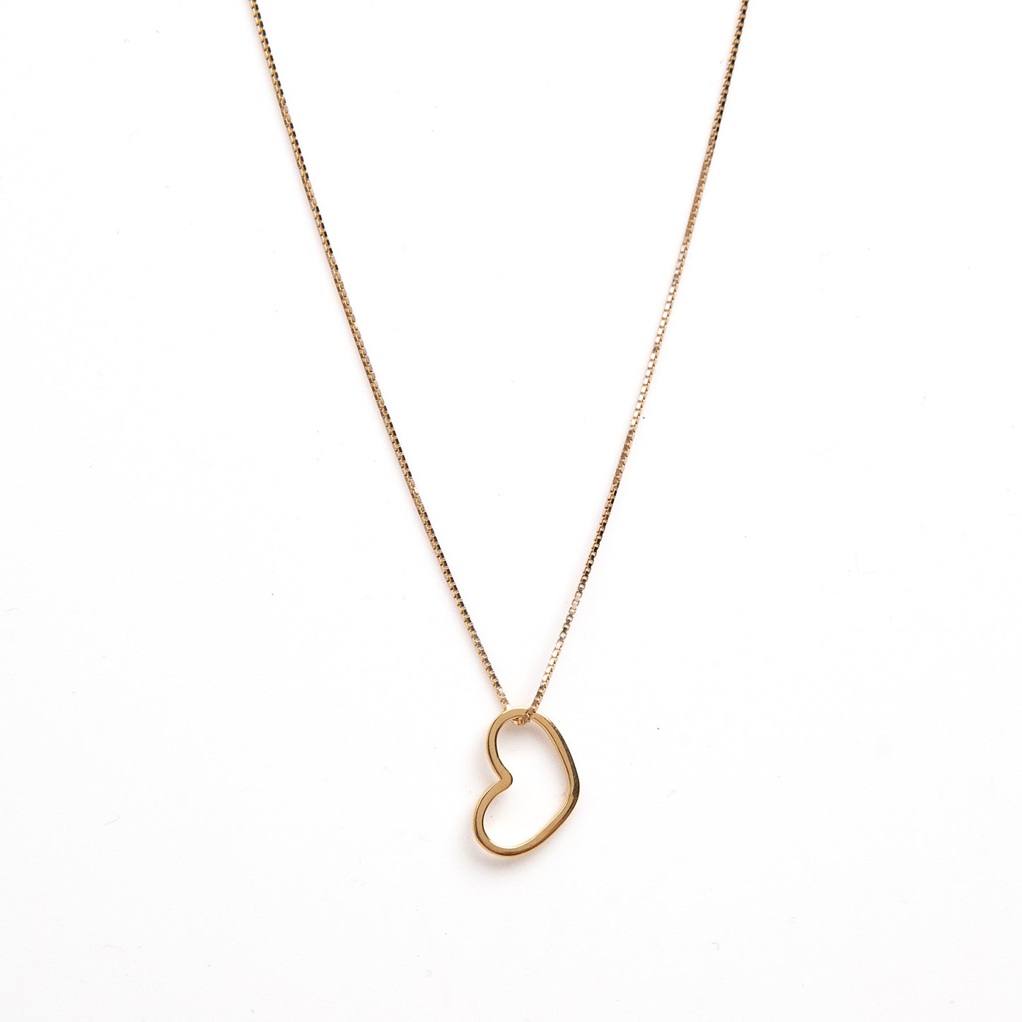 Embrace timeless elegance with our 18 kt Gold Minimal Heart Pendant. This delicate piece features a minimalist heart design, perfect for everyday wear for women. With its lightweight feel and versatile style, it's an ideal addition to your daily wear outfit or a thoughtful gift for her. Explore our affordable collection, all under 10,000, and discover the perfect piece to elevate your look from 9 to 5 and beyond.