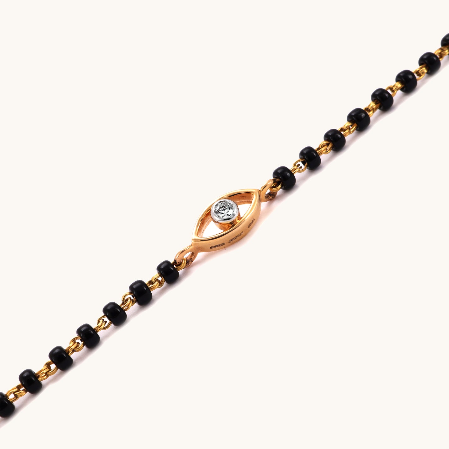 Diamond Evileye Mangalsutra Bracelet in 18kt gold, featuring IGI certified VVS diamonds under Rs. 25k. Luxury jewelry for women from Caratly, ideal for gifts and special occasions.