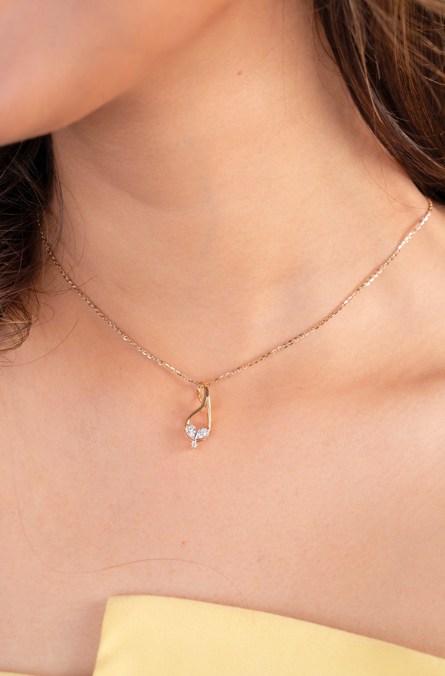 Discover timeless elegance with our exquisite 18kt Entwin Diamond Pendant from the Spring Edit collection, priced under Rs. 30,000. This stunning piece seamlessly blends elegance and sophistication, making it a perfect addition to your everyday fine jewelry collection. Whether for yourself or as a thoughtful gift for her, this pendant is sure to elevate any style with its timeless beauty.