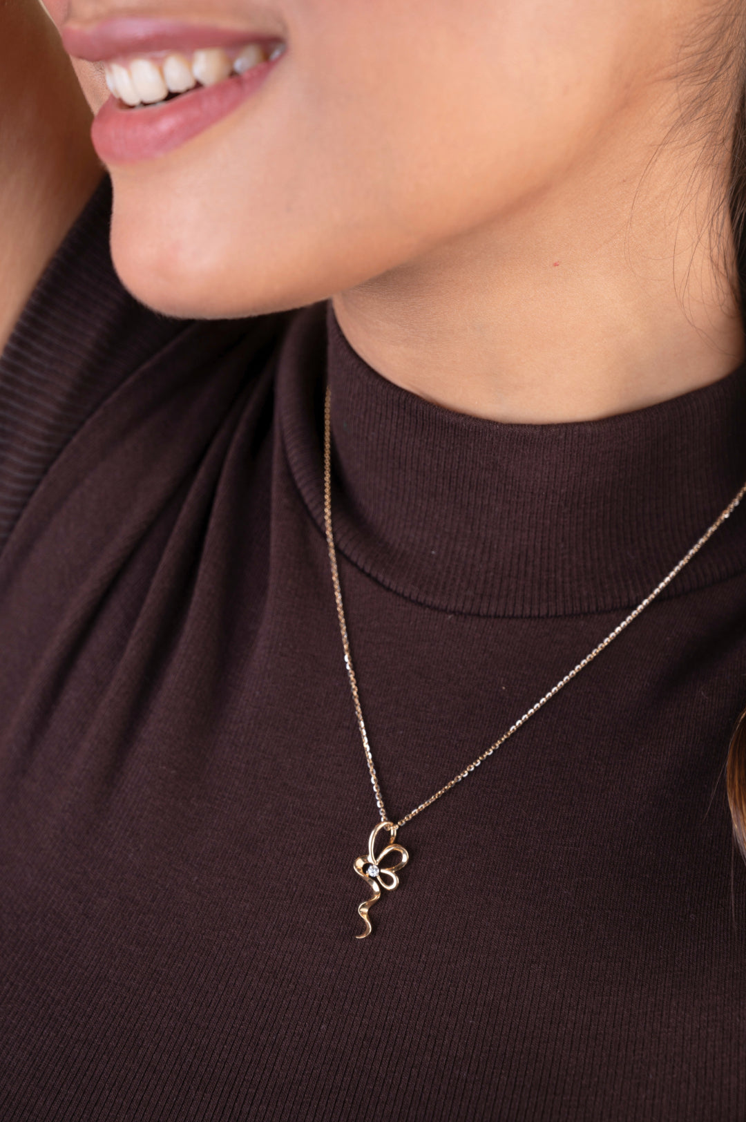 Elevate your elegance with our 18 kt Flower Twirl Pendant from the Spring Edit. Crafted with finesse and priced under 30,000, it's an ideal addition to your everyday wear jewelry collection. Surprise her with this exquisite piece—it's not just a pendant, it's a cherished gift.