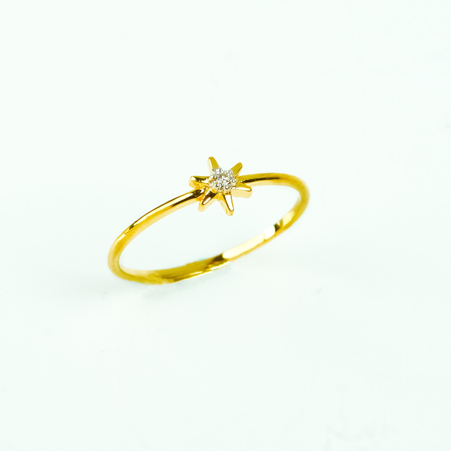 Shine bright with our Star Diamond Ring, crafted in elegant 18kt Gold. This delicate ring is perfect for daily wear for Women, adding a touch of sparkle to any outfit. A thoughtful gift for her. This piece is ideal for both workwear and casual attire. Explore our affordable Under 10,000 jewellery collection.