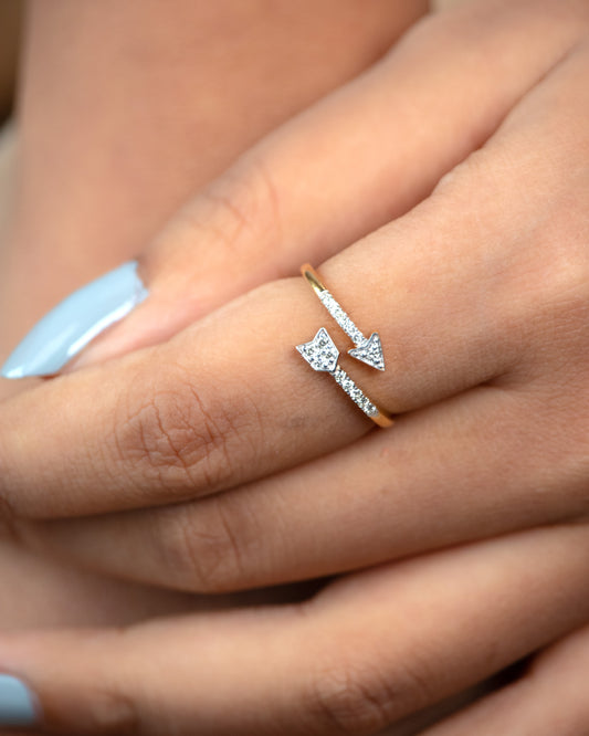 Capture the essence of elegance and romance with our Heart Arrow Ring, crafted in 18kt gold. With a lightweight design, it's perfect for daily wear, effortlessly elevating any outfit from 9 to 5 and beyond. Affordable gifting ideas for her from our Under 30,000 collection.