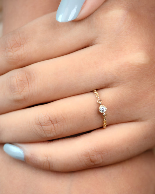 Discover effortless elegance with our chic 18kt Gold Chain Diamond Ring. Perfect for everyday wear, it seamlessly blends sophistication with versatility. An affordable gifting option from our under 10,000 collections. Elevate your workwear edit with this affordable luxury.