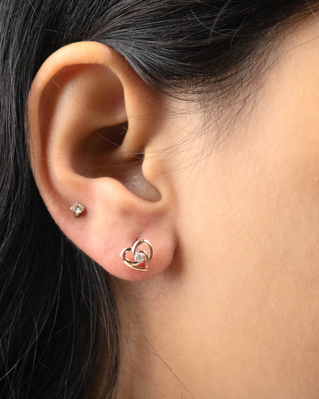 Add a touch of romance to your wardrobe with our Heart-Stud Earring, crafted in luxurious 18kt gold. Explore our affordable collection under 30,000 for gifting ideas curated to delight her, perfect for any occasion. Elevate your workwear edit with this charming accessory that adds a hint of luxury to your look.