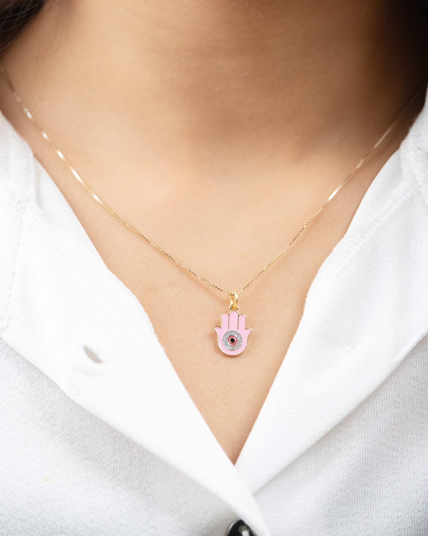 Pink Hamsa Charm crafted with 18kt gold. It's perfect for daily wear, symbolizing protection and good fortune. Explore our affordable collection for gifting ideas under 30,000, and discover the perfect addition to your 9 to 5 workwear edit.