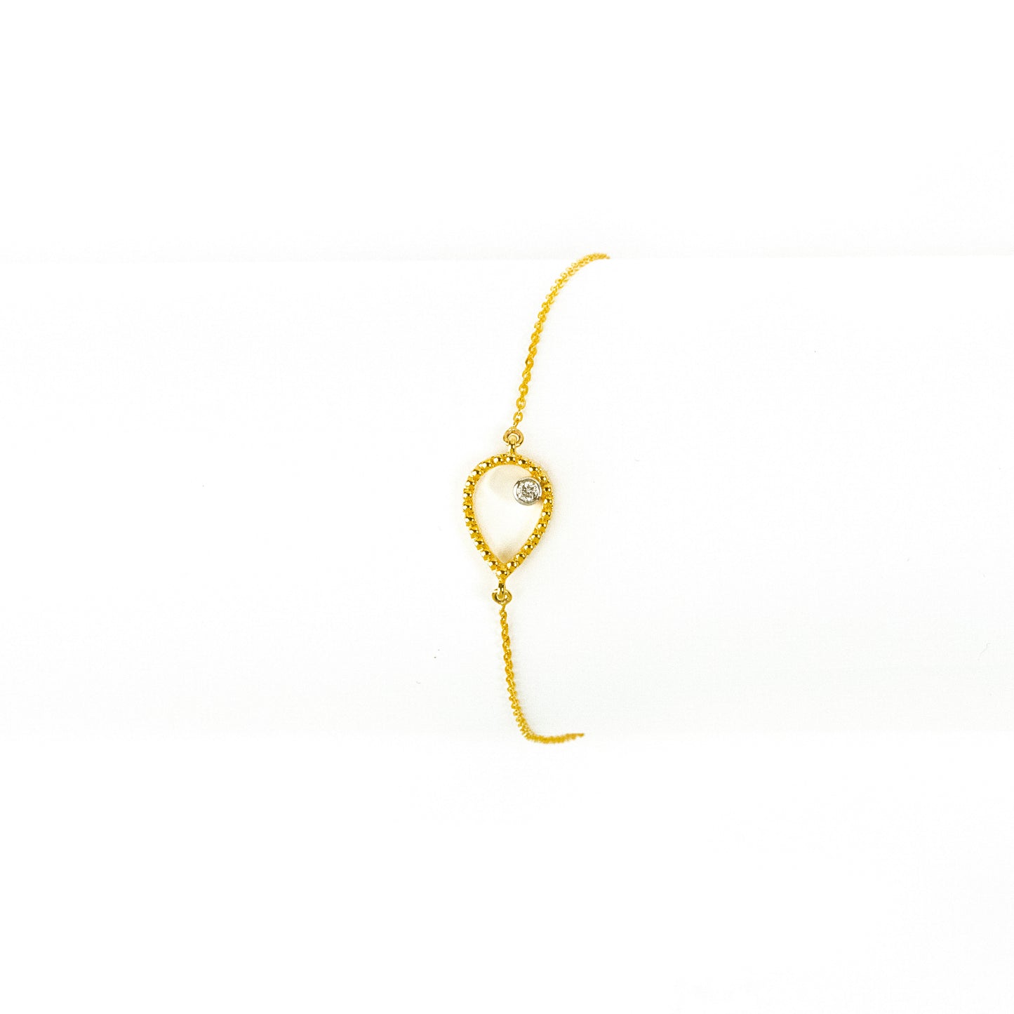 18kt Gold Pear Diamond Bracelet for women under 30,000. Delicate jewellery for everyday elegance. Gift a touch of brilliance to her to elevate her 9 to 5 look effortlessly.