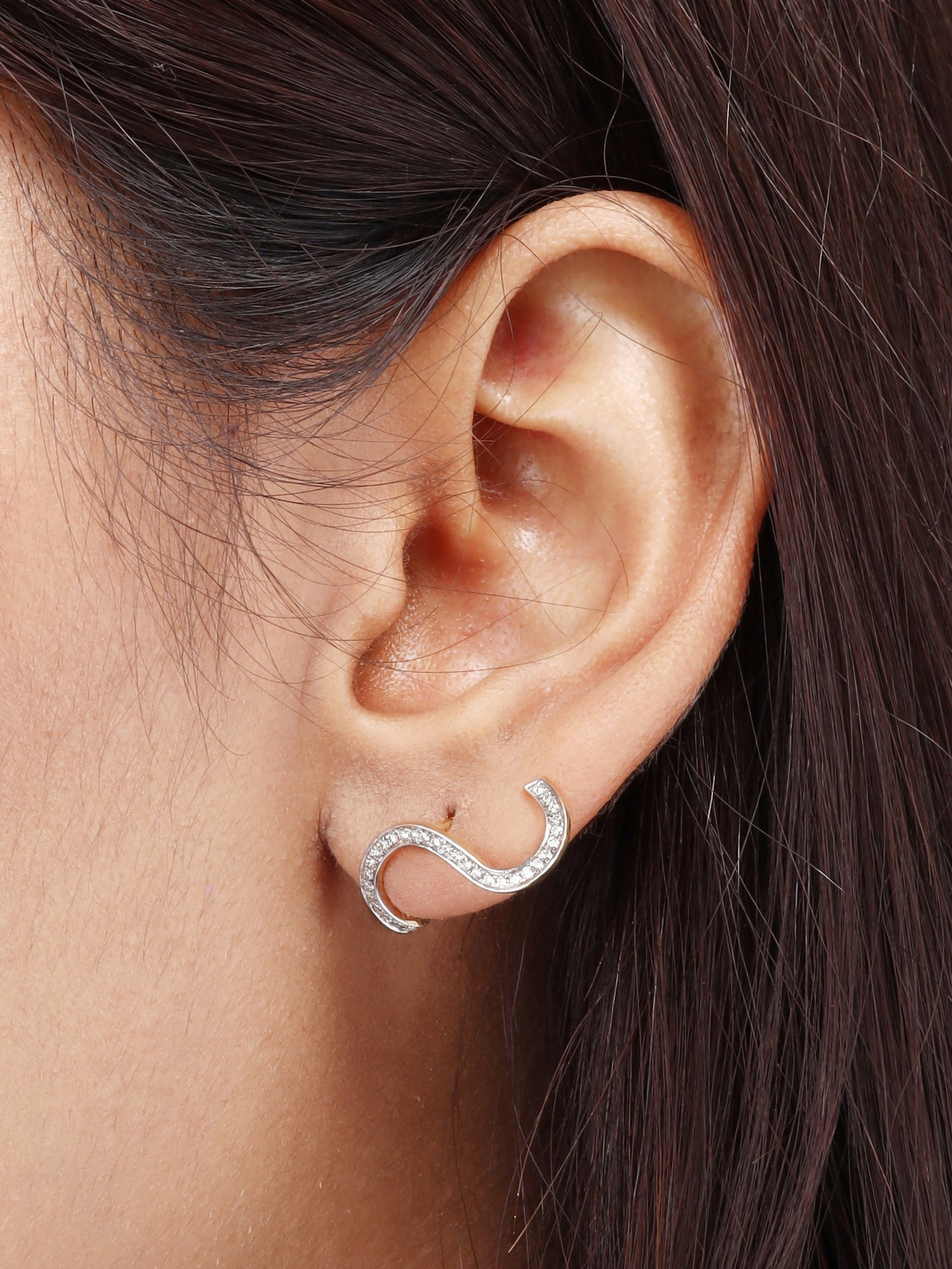 Elevate your style with our S Diamond Earrings crafted in elegant 18kt gold for women. Gift these earrings to celebrate special occasions or simply to show your admiration. Elevate her office wear edit from the jewellery collection under Rs. 50,000.