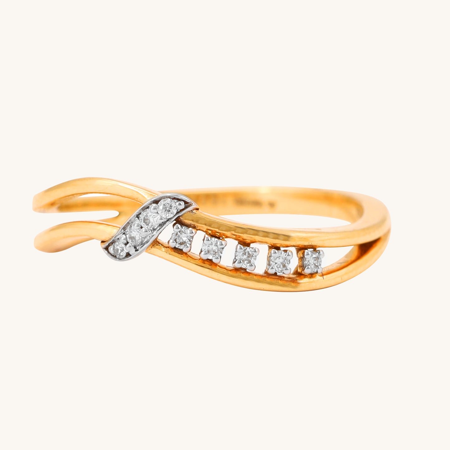 Embrace the elegance of our Sway Diamond 18kt Gold Ring, a sophisticated accessory that adds a touch of timeless beauty to any outfit. Whether you're seeking a thoughtful gift for her or a versatile ring to complement your casual and work-wear ensembles, this piece is perfect. Priced under 30,000, it effortlessly transitions from the office to weekend getaways