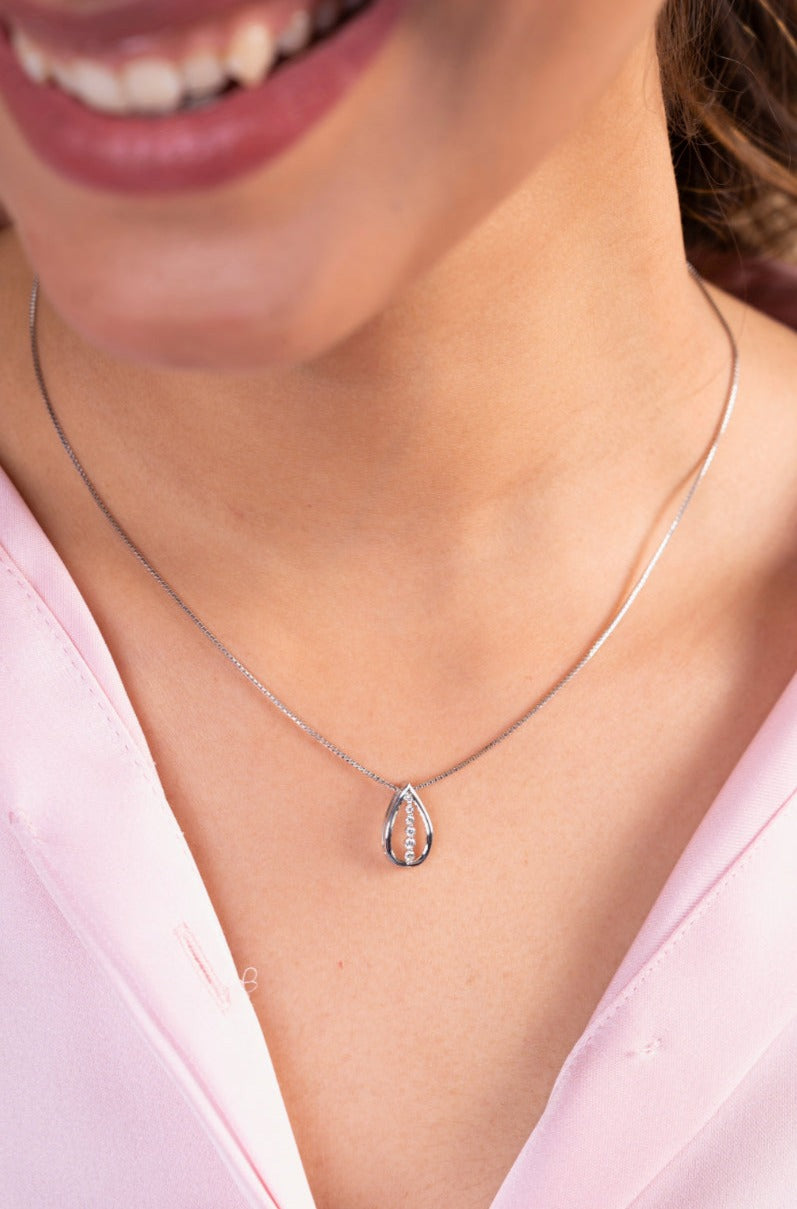 Indulge in timeless elegance with our 18 kt Teardrop Diamond Pendant from the Spring Edit collection, priced below 30,000. This exquisite piece is a must-have addition to your everyday jewelry collection, radiating sophistication and grace. Whether for personal adornment or as a heartfelt gift.