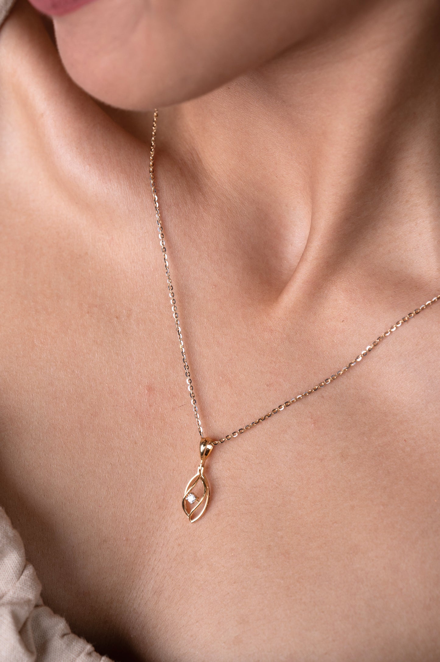 Express your affection with our swirling 18kt gold Swirl Heart Pendant. This delicate design adds a romantic touch to your everyday attire, perfect for elevating your workwear or complementing your casual ensemble. Whether it's a gift for her or a special treat for yourself, this pendant embodies elegance and sentimentality. Discover our Under 30,000 collection now.