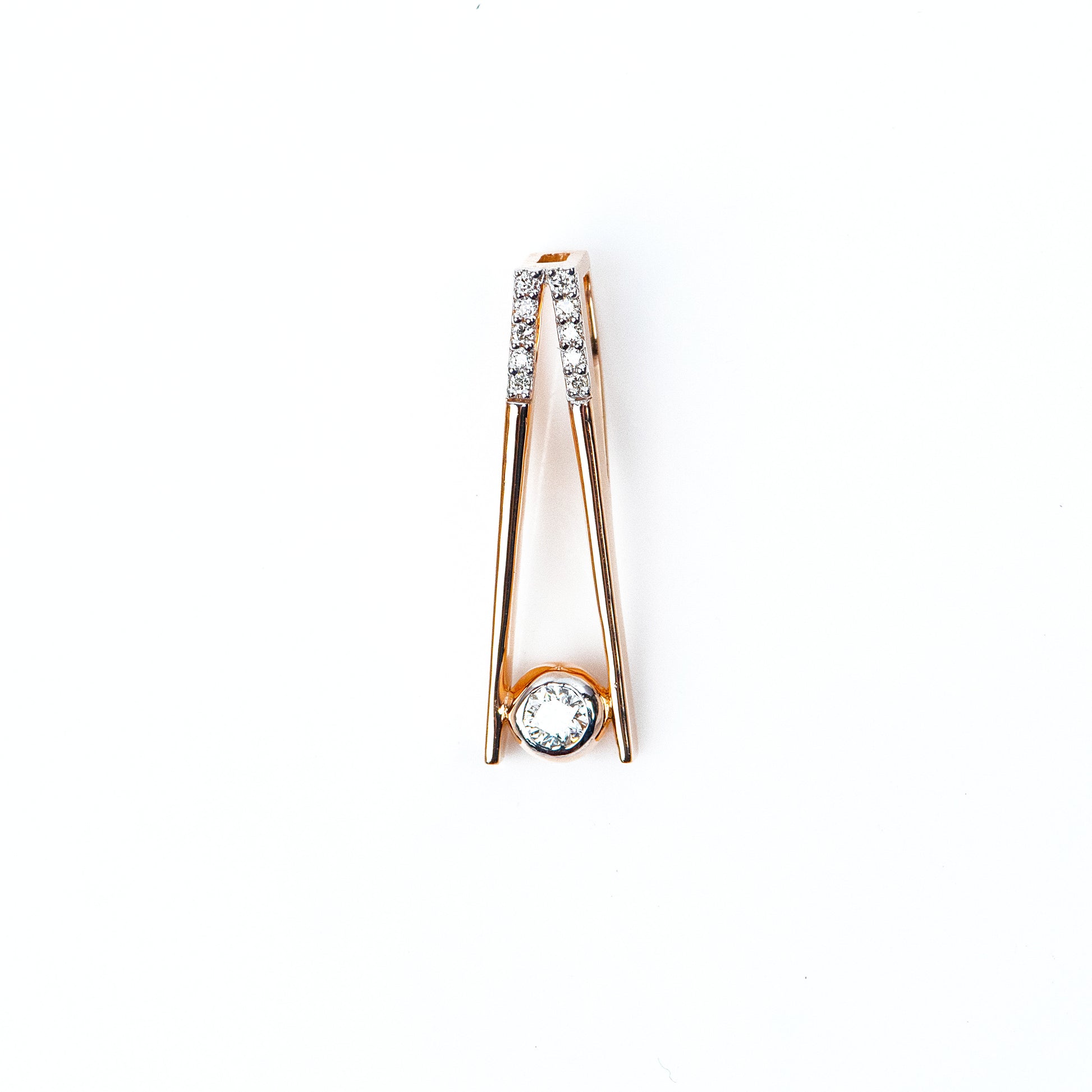 Caratly 18kt gold Elegant Diamond Pendant with 0.10ct solitaire diamond in a modern V-shape drop setting. Minimalist gift ideas for her under 40,000