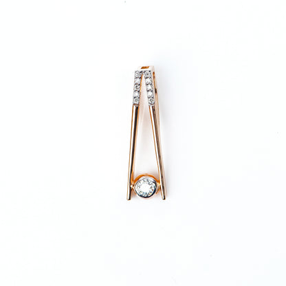 Caratly 18kt gold Elegant Diamond Pendant with 0.10ct solitaire diamond in a modern V-shape drop setting. Minimalist gift ideas for her under 40,000