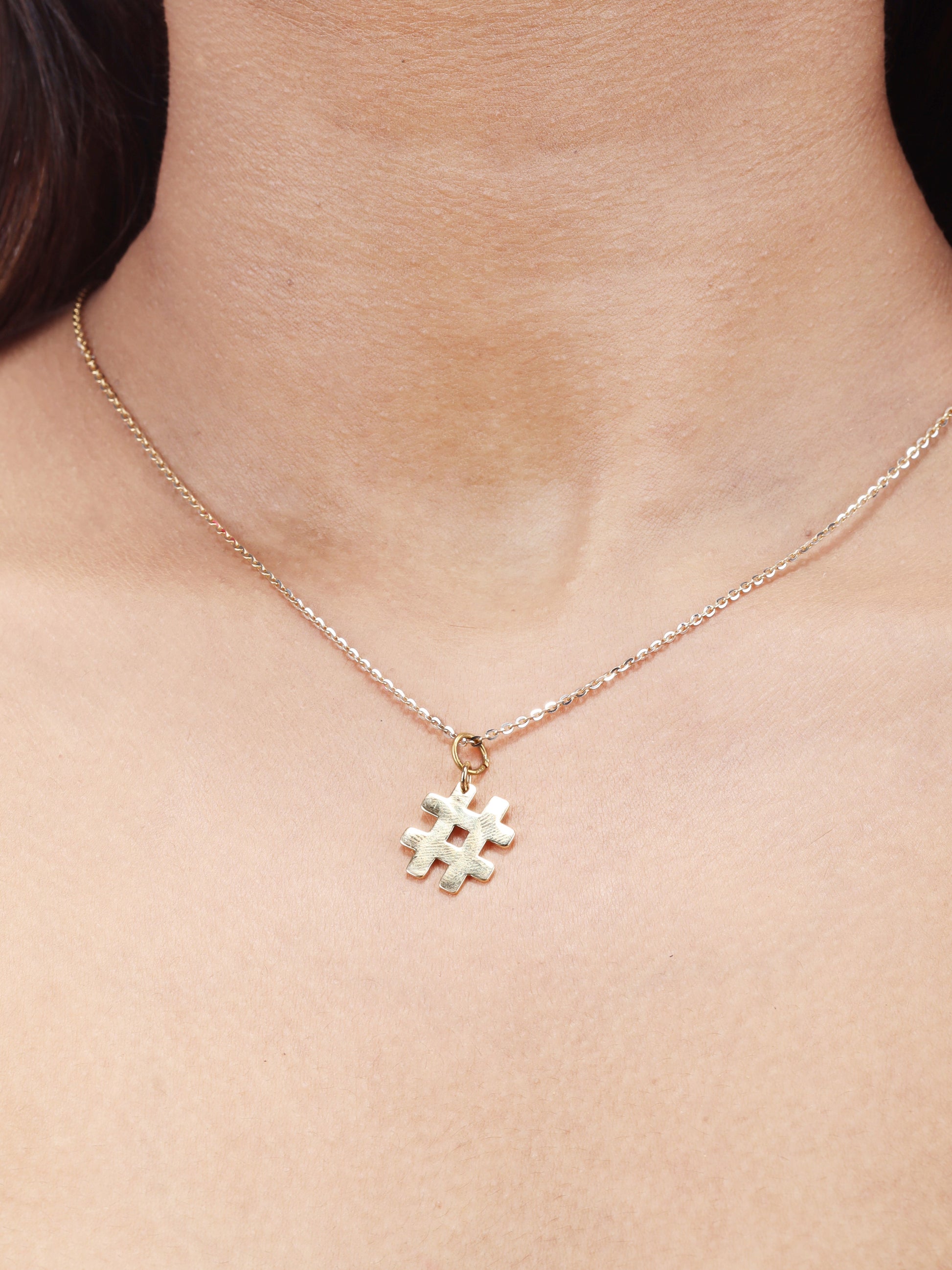 Make a chic statement with our Hashtag Gold Pendant crafted in radiant 18kt Gold. This versatile pendant is perfect for daily wear for Women. Gift ideas for her. This piece is ideal for both workwear and casual outfit. Explore our affordable Under 10,000 collection for chic and budget-friendly jewellery options.