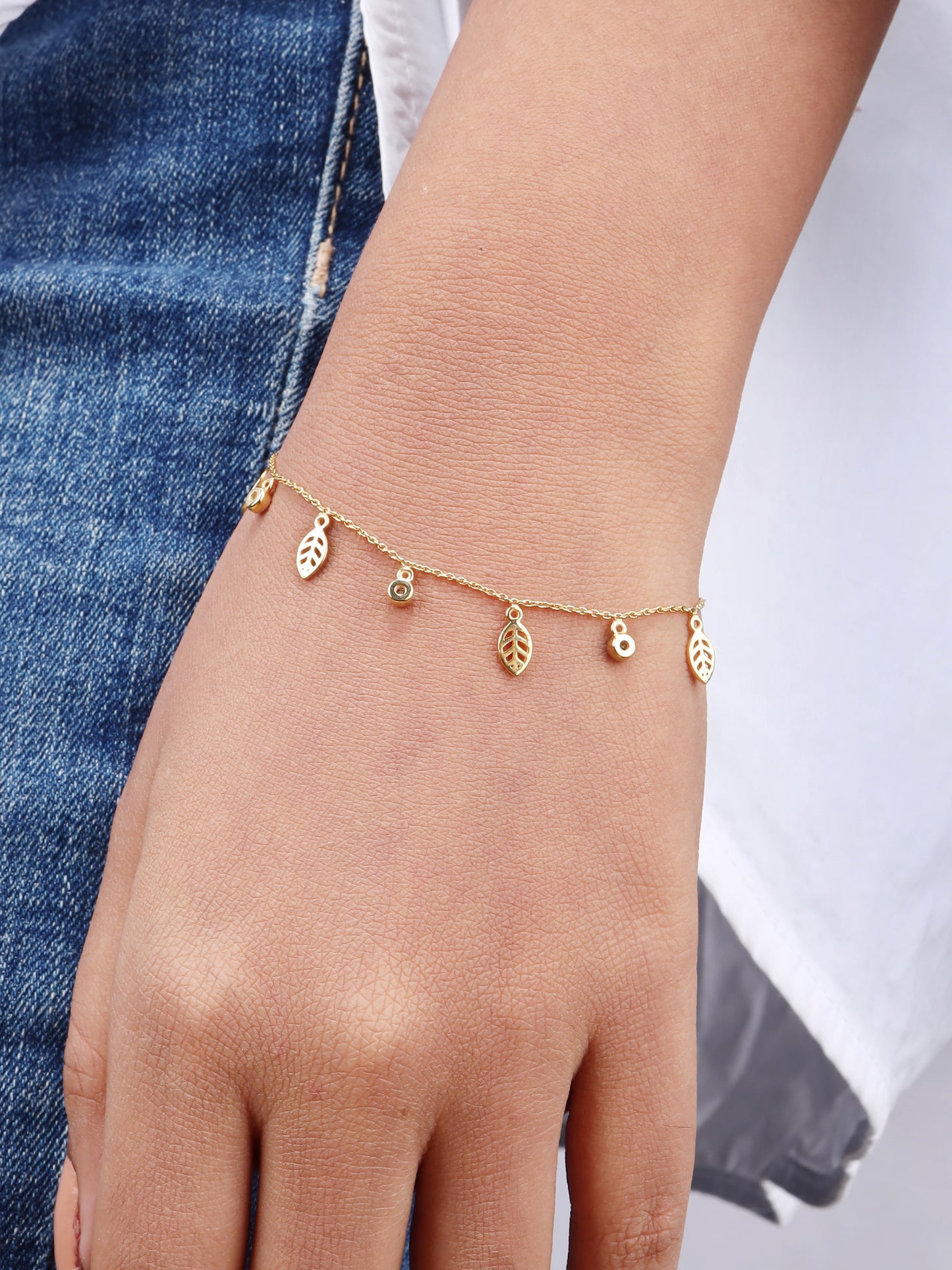 Leaf diamond bracelet made with 18 kt gold. Nature-inspired sparkle for women. Affordable gift for everyday elegance under Rs, 30,000. Elevate your 9 to 5 look by adding this jewellery piece to your collection.