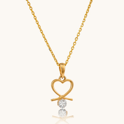 Love Heart Locket in 18kt gold and diamond. Shop trendy gold and diamond jewellery online under Rs 20,000. Latest 2024 collection of minimal designs. Best prices in India for stylish jewellery. Gifts in gold for loved ones. Gold and diamond jewellery online, Latest collection, Best prices in India, Trendy jewellery.