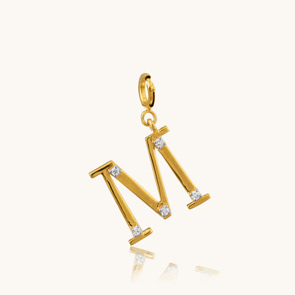 Personalize your style with our exquisite 18kt gold M Diamond Pendant. Adorned with sparkling diamonds in the shape of the letter "M", it adds a touch of personalized luxury to any ensemble. Perfect for special occasions or celebrating a loved one's initial, this pendant is ideal for everyday wear, whether it's for work or evening attire. Treat yourself to this stunning piece, priced under 30,000.