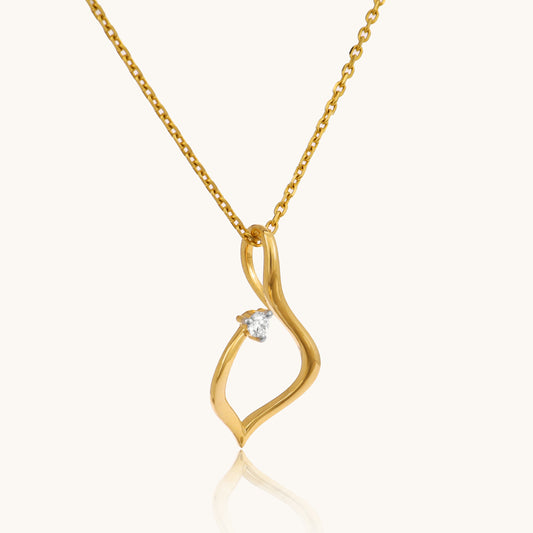 Elevate your everyday look with our delicate Twirly Diamond Pendant, crafted in 18kt gold. This playful design dances with every move, adding a touch of whimsy and sparkle to your attire, whether it's your workwear edit or casual ensemble. A perfect gift for her priced under 30,000, this pendant is both charming and versatile.