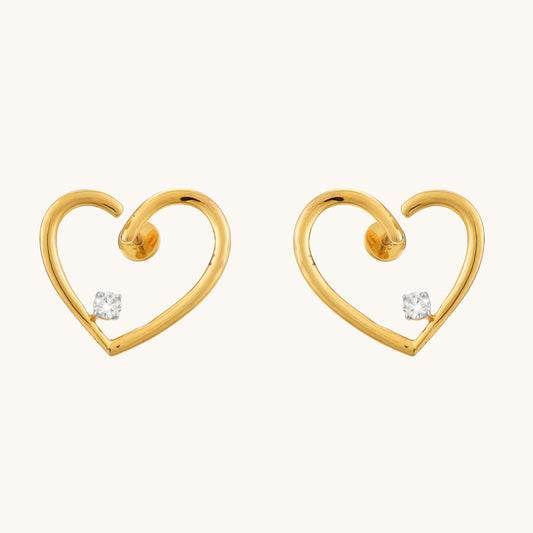 Express your love with the sparkling elegance of the Heart Diamond Earrings crafted in 18kt gold. These earrings add a touch of timeless romance to your everyday look, perfect for casual wear, work attire, or a special occasion. They make a thoughtful gift idea for her all under Rs. 30,000.