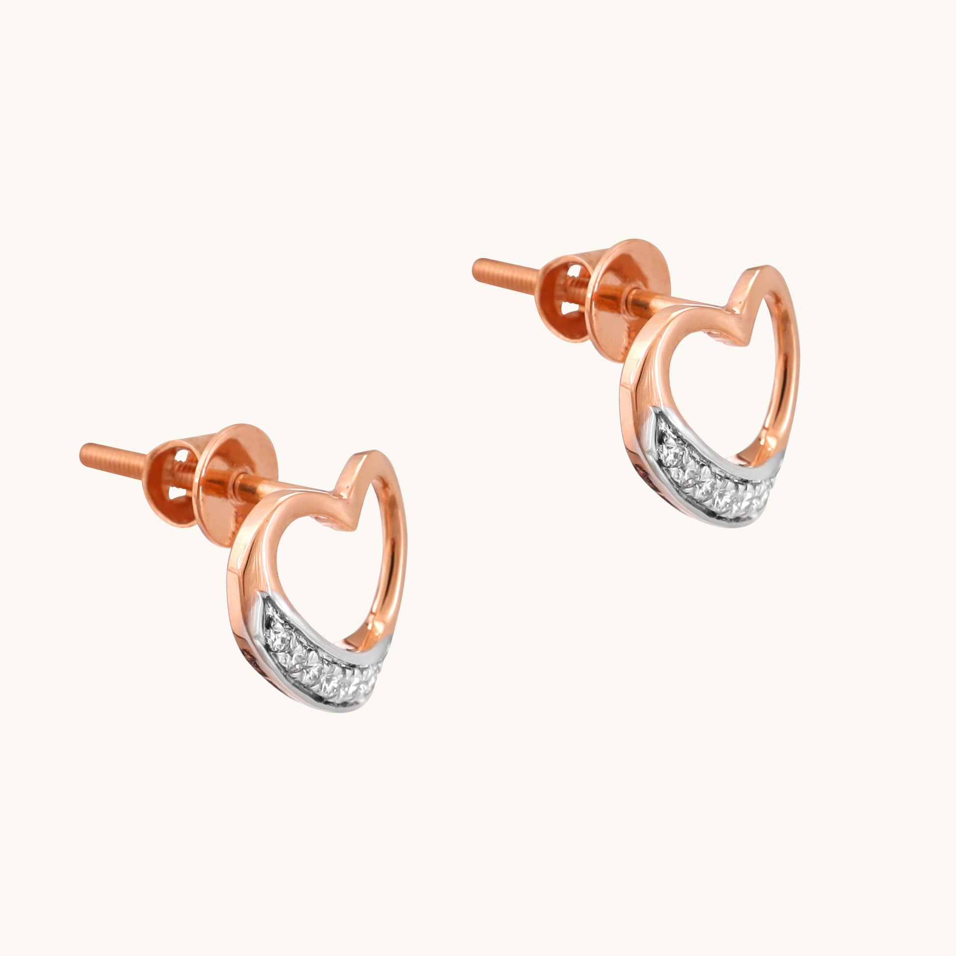 Show your love with a touch of modern elegance. These minimalist heart line earrings, crafted in 18kt gold, are perfect for everyday wear. Delicate and versatile, they complement any outfit, from casual to workwear. A thoughtful and affordable gift idea for her under Rs. 30,000.