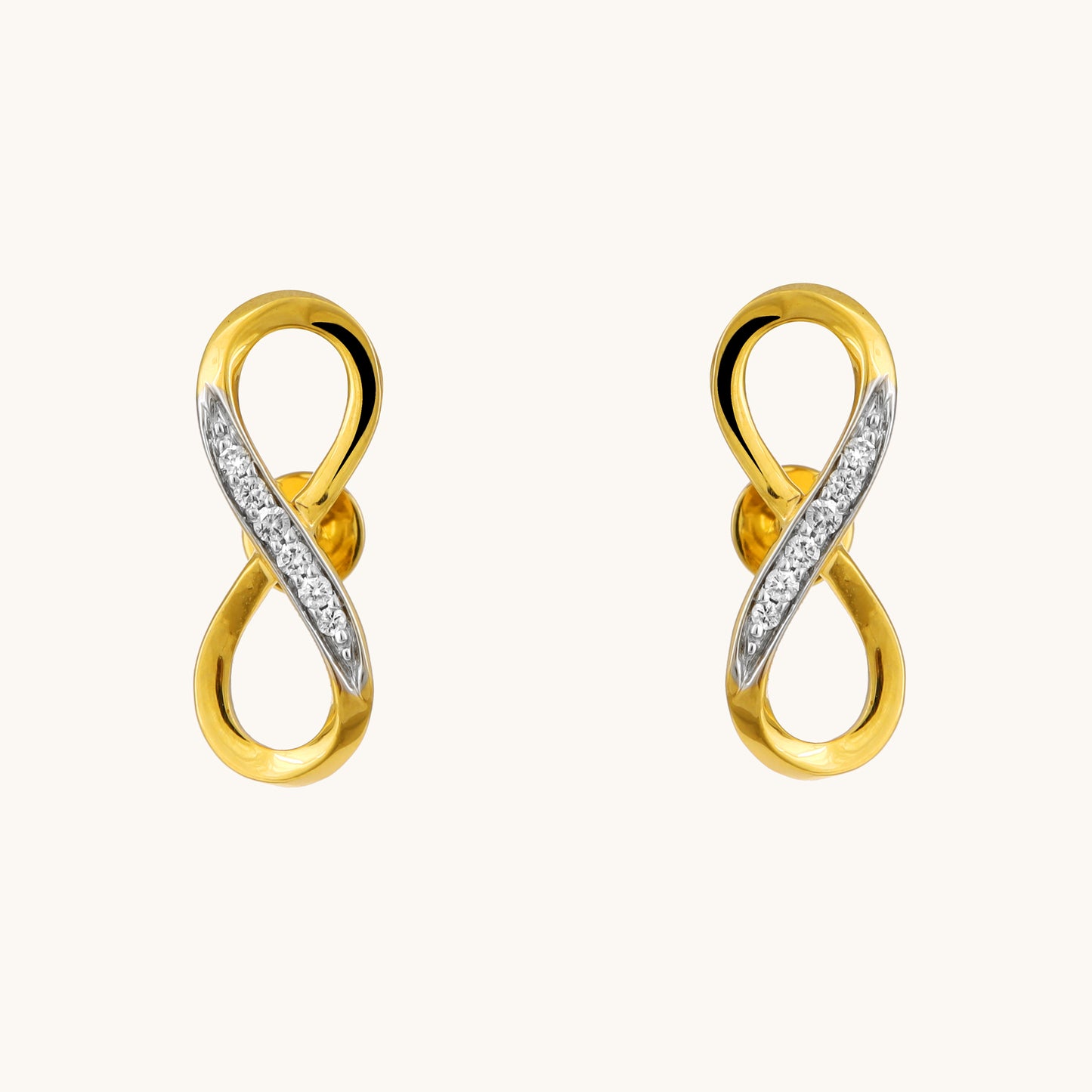 Celebrate everlasting love with the Infinity Diamond Earrings. Crafted in 18kt gold and featuring sparkling diamonds, these earrings add a touch of timeless elegance to your everyday look. Perfect for casual wear, work attire, or a special occasion, they make a meaningful gift idea for her under Rs. 30,000.