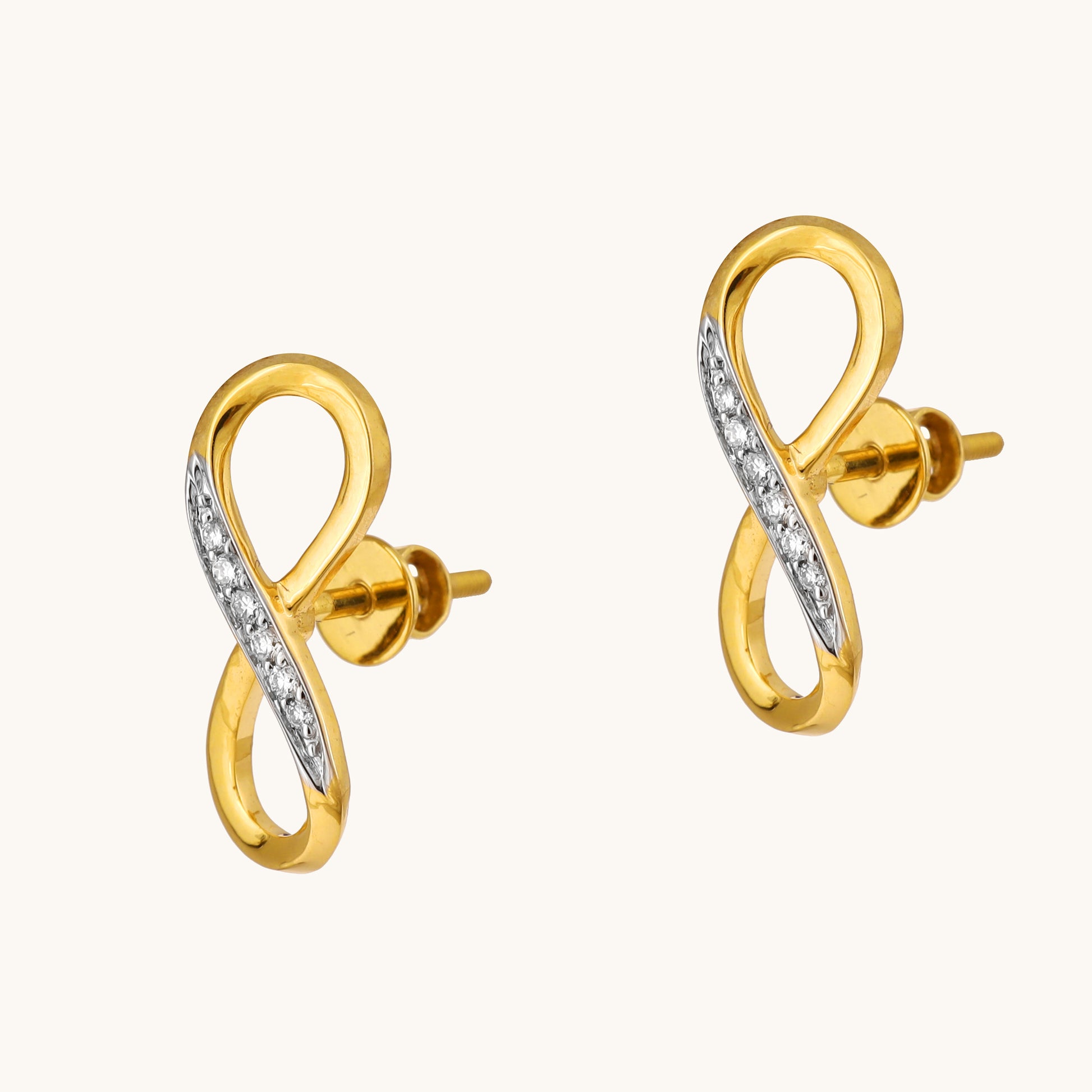 Celebrate everlasting love with the Infinity Diamond Earrings. Crafted in 18kt gold and featuring sparkling diamonds, these earrings add a touch of timeless elegance to your everyday look. Perfect for casual wear, work attire, or a special occasion, they make a meaningful gift idea for her under Rs. 30,000.