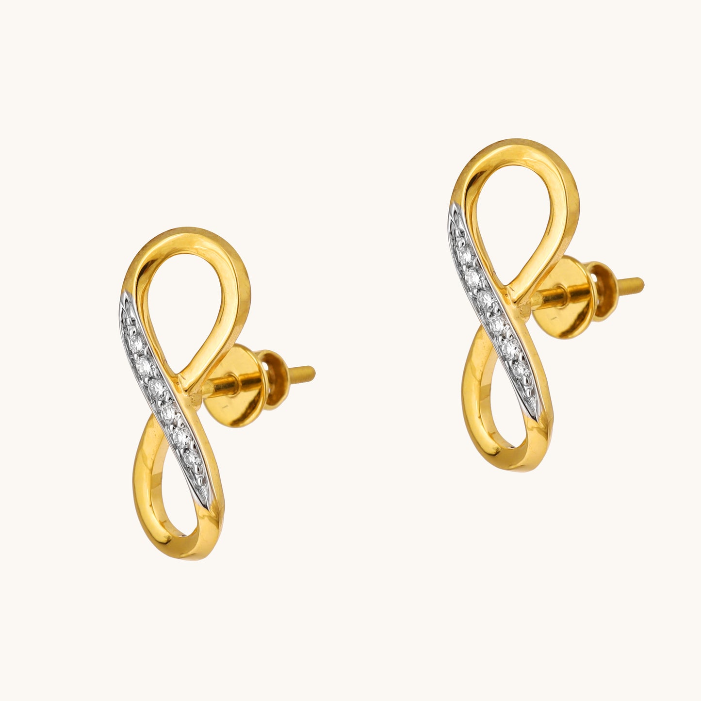 Celebrate everlasting love with the Infinity Diamond Earrings. Crafted in 18kt gold and featuring sparkling diamonds, these earrings add a touch of timeless elegance to your everyday look. Perfect for casual wear, work attire, or a special occasion, they make a meaningful gift idea for her.