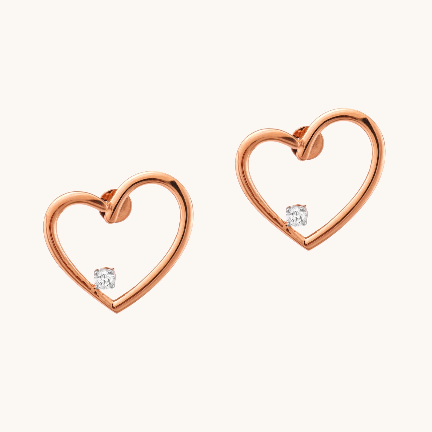 Express your love with the sparkling elegance of the Heart Diamond Earrings crafted in 18kt gold. These earrings add a touch of timeless romance to your everyday look, perfect for casual wear, work attire, or a special occasion. They make a thoughtful gift idea for her all under Rs. 30,000.