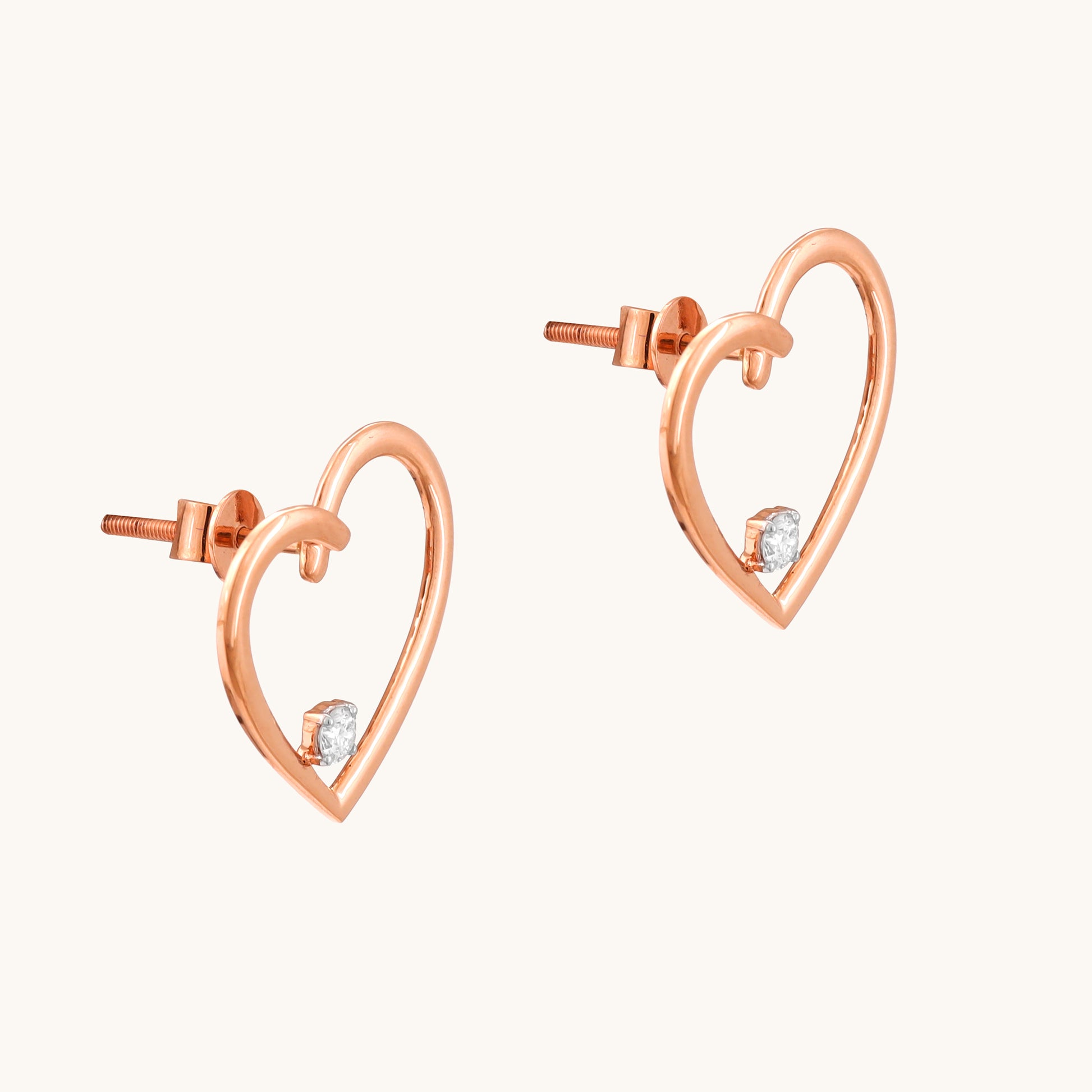 Express your love with the sparkling elegance of the Heart Diamond Earrings crafted in 18kt gold. These earrings add a touch of timeless romance to your everyday look, perfect for casual wear, work attire, or a special occasion. They make a thoughtful gift idea for her all under Rs. 30,000.