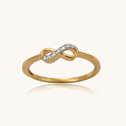 Embrace eternal love with our delicate 18 kt gold Infinity Simple Ring adorned with natural diamonds. Perfect for everyday wear, work, or casual looks, this ring features a sparkling diamond, adding a touch of elegance to any ensemble. An ideal gifting idea for her.